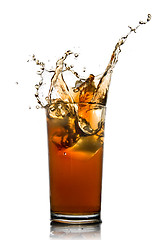 Image showing Beautiful splash of cola in glass isolated on white