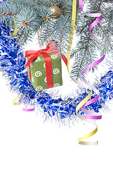 Image showing Christmas gift and decoration on fir tree branch isolated on whi