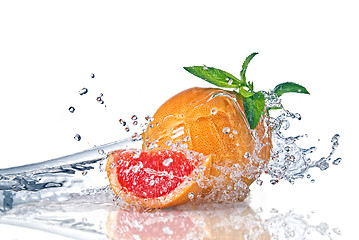 Image showing Water splash on grapefruit with mint isolated on white