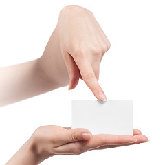 Image showing Womans hands holding and pointing empty visiting card isolated o