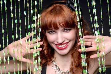 Image showing beauty smiling girl with curtains