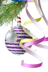 Image showing Christmas balls and decoration on fir tree branch isolated on wh