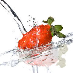 Image showing Fresh strawberry and water splash isolated on white