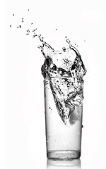 Image showing water splash in glass isolated on white