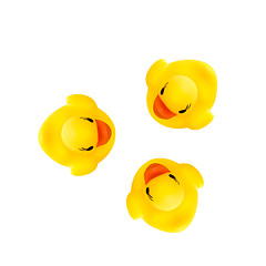 Image showing three rubber yellow ducks isolated on white