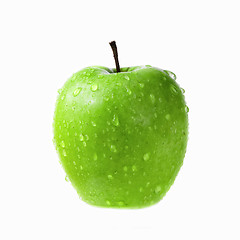 Image showing green apple with drops of water isolated on white