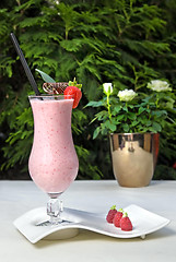 Image showing strawberry milkshake on the table