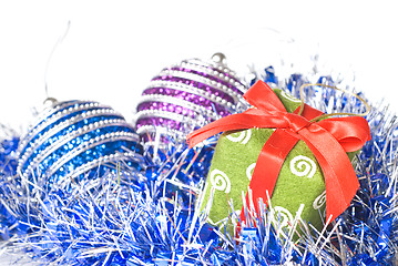 Image showing christmas balls with and gift with decoration isolated on white