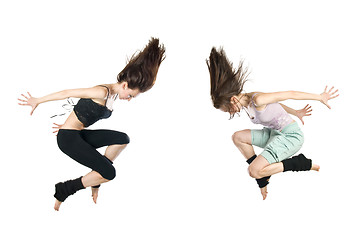 Image showing jumping young dancers isolated on white background