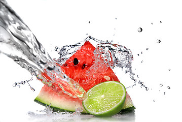 Image showing watermelon with lime and water splash isolated on white