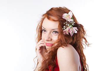 Image showing Portrait of beautiful woman with spring flowers on white