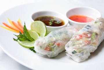 Image showing chinese rolls with vegetables on the plate