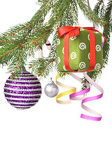 Image showing Christmas balls, gift and decoration on fir tree branch isolated