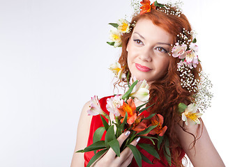 Image showing Portrait of beautiful woman with spring flowers 