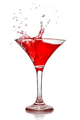 Image showing Red cocktail with splash isolated on white