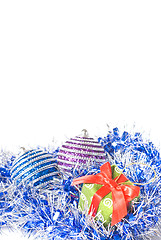 Image showing christmas balls with and gift with decoration isolated on white