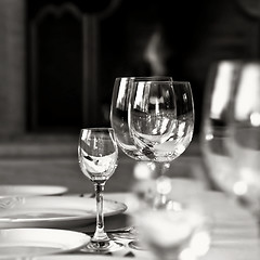 Image showing black and white photo of glass goblets on the table