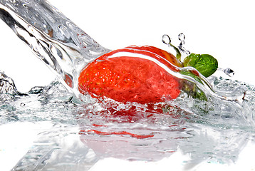 Image showing Fresh strawberry and water splash isolated on white