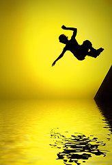 Image showing silhouette of roller boy jumping in air