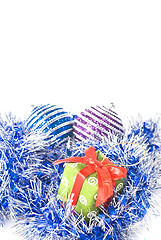 Image showing christmas balls with and gift with decoration isolated on white