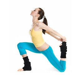 Image showing beautiful girl doing gymnastics on white background