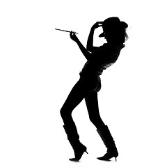 Image showing silhouette of smoking girl with hat