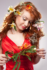 Image showing Portrait of beautiful woman with spring flowers