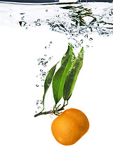 Image showing Splash of orange to water with bubbles of air