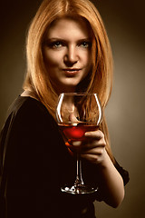 Image showing woman with red hair holding wine glass