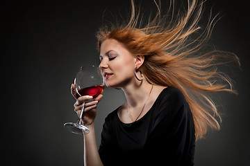 Image showing woman with red hair holding wine glass