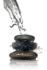 Image showing Spa stones with water splash isolated on white