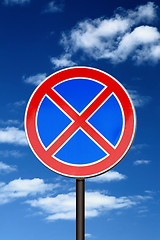 Image showing road sign no parking against blue sky and clouds