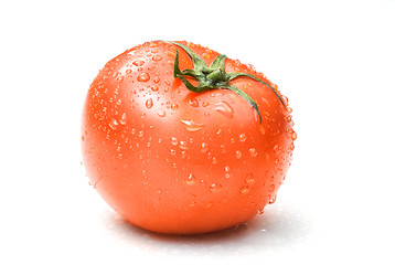 Image showing red tomato with water drops isolated on white