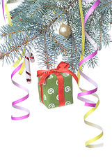 Image showing Christmas gift and decoration on fir tree branch isolated on whi