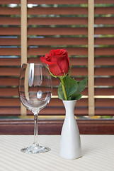 Image showing wineglass and rose on the table