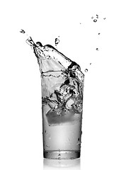 Image showing water splash in glass isolated on white