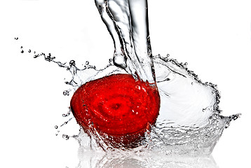Image showing red beet with water splash isolated on white