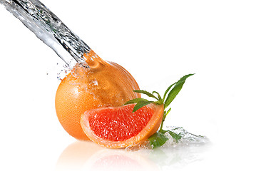 Image showing Water splash on grapefruit with mint isolated on white