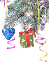 Image showing Christmas ball, gift and decoration on fir tree branch isolated 