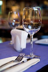 Image showing wineglass on served table in restaurant