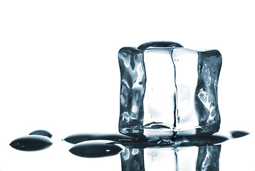 Image showing ice cube with water drops on white