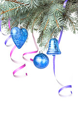 Image showing Christmas balls and decoration on fir tree branch isolated on wh