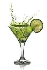 Image showing Green alcohol cocktail with splash and green lime isolated on wh