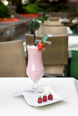 Image showing strawberry milkshake on the table