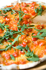 Image showing classic italian pizza with tomatos