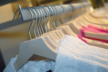 Image showing clothes on racks in store