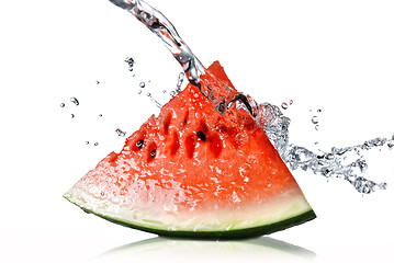 Image showing watermelon and water splash isolated on white