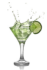 Image showing Green alcohol cocktail with splash and green lime isolated on wh