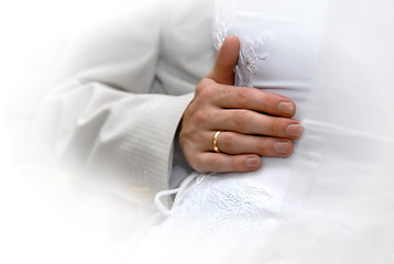 Image showing Just Married. Grooms hand with gold ring