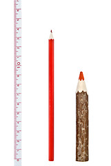 Image showing Red thick and thin pencils with ruler isloated on white